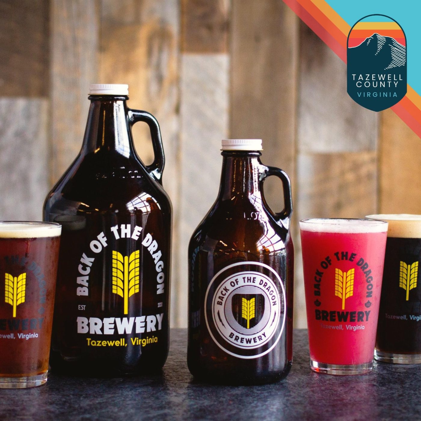 a row of back of the dragon brewery beer growlers and various cups on a table -best gifts for motorcycle enthusiasts